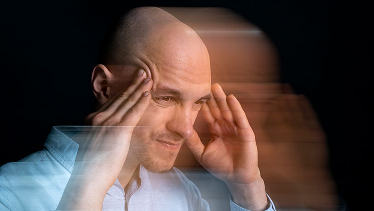 Man holding temples