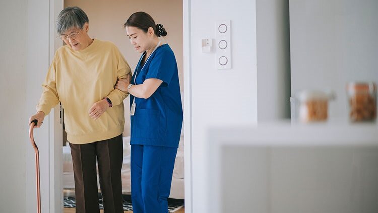 Nurse helping older woman