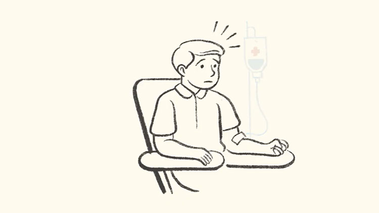 Man sitting in chair with bag drip