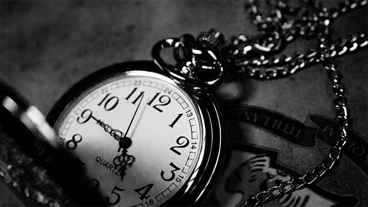 black and white photo of antique pocket watch