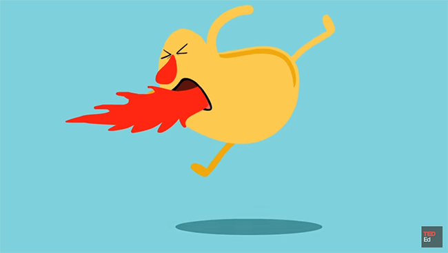Image of a cartoon character jumping in the air with fire coming out of its mouth after eating a spicy food.