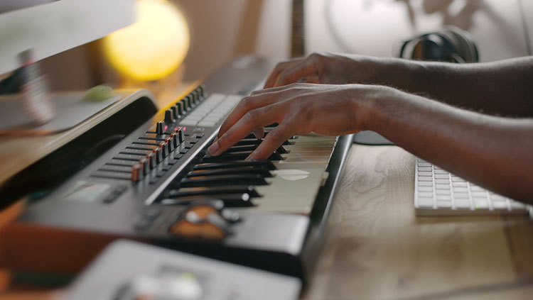 Hands playing keyboard